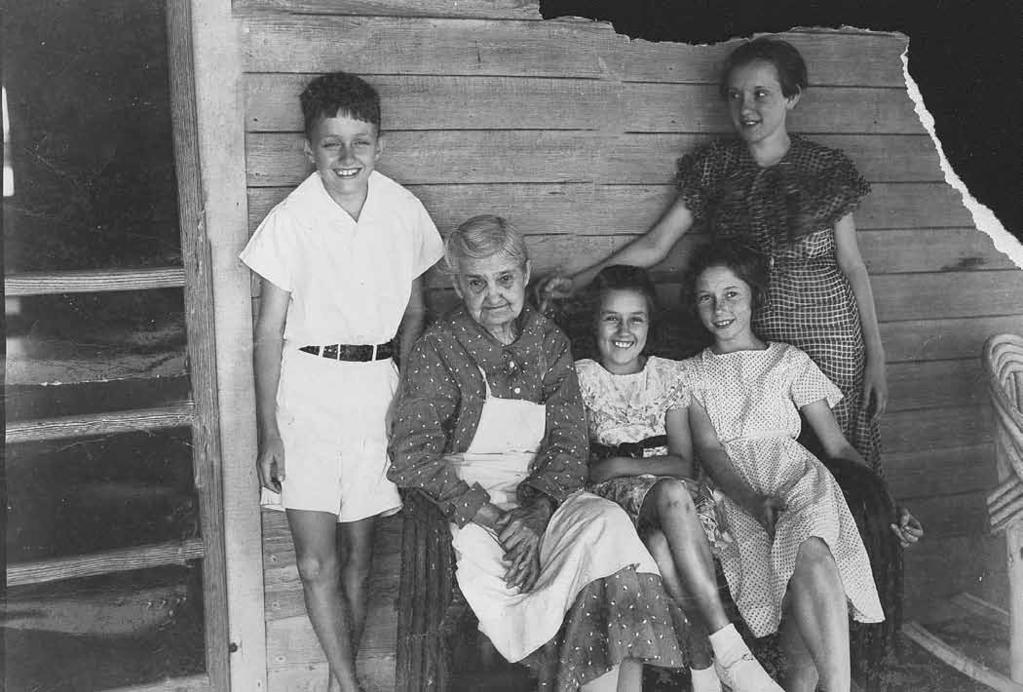 Photograph of Idonia Kelly, step-grandchildren; Sam and Martha Ann Kelly, neighbors; Janet Hood and Doris Storey once president of the board of trustees of that institution.