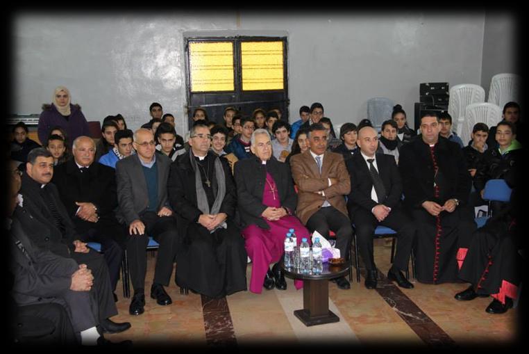 Johny Abu Khalil, the parish priest, Abeer Hanna, the school principal, and the members of the staff.