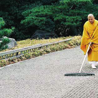ZEN MONKS RAKING GRAVEL It takes a lot of effort and care to get the lines and circles just right.