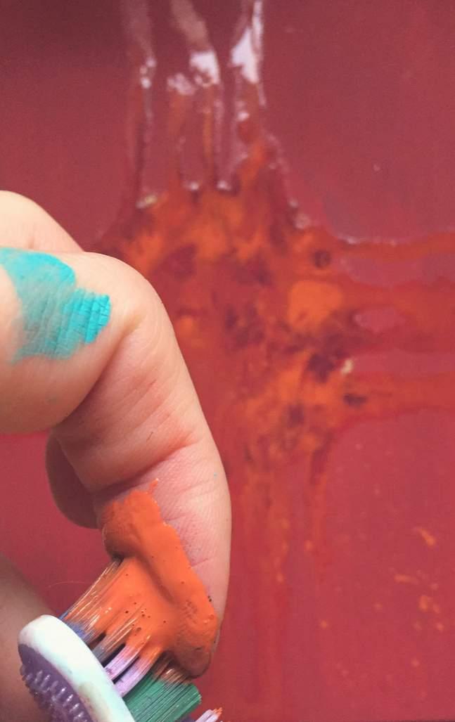 Using your toothbrush, flick all 3 shades onto your canvas.