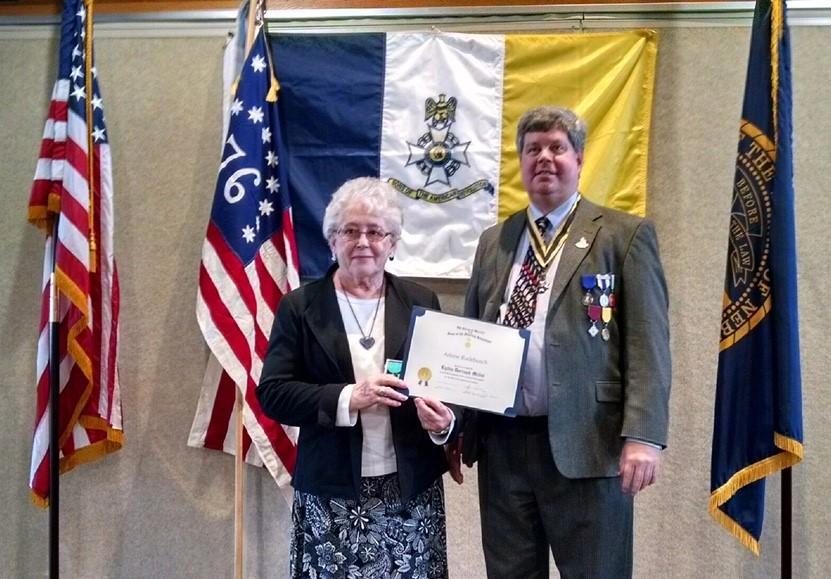 ISSUE 24 Arlene Rudebusch receiving the Lydia Darragh Medal. Nebraska Society President John Reinert presented Mrs.
