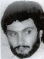 Build:-Unknown- - Language:-Arabic Scars and Marks:-None known Remarks:-Mugniyah is the alleged head of the security apparatus for the terrorist organization, Lebanese Hizballah.