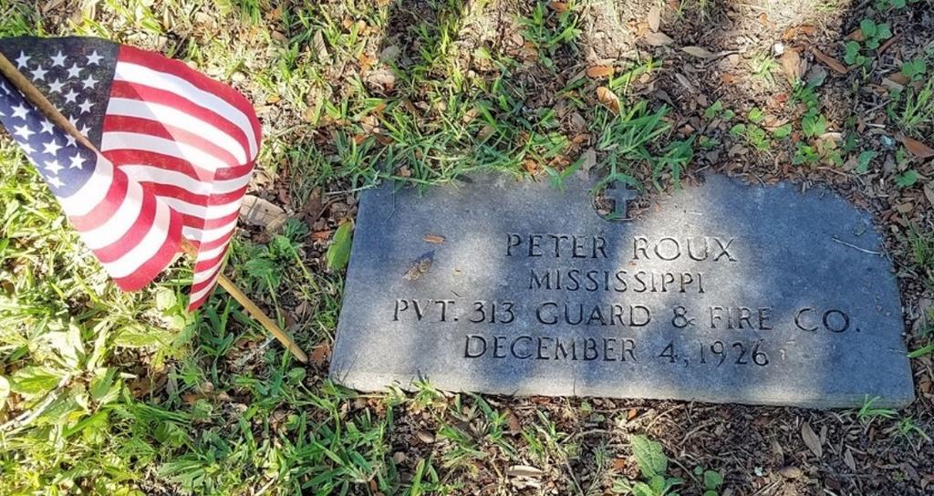 Paul Cemetery and placed flags next to the headstone of the identified servicemen and women there.
