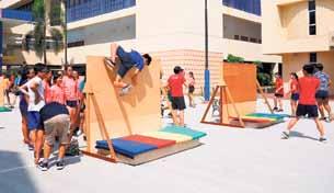 The completed obstacle course was a marvel to behold. Running through the school, it featured four painted high walls, a Jacob s ladder, a suspension bridge, and several station games.
