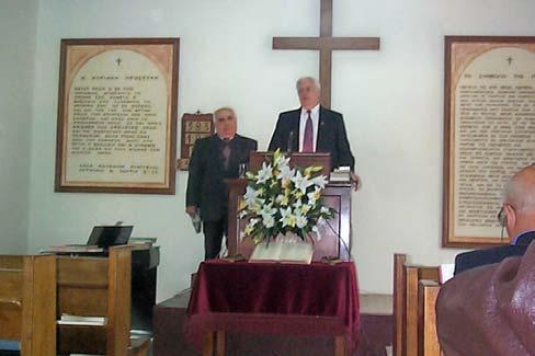 Pastor John comforting bereaved parents.