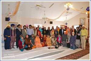 honored guests and members of the Sikh community in the Temple Sanctuary
