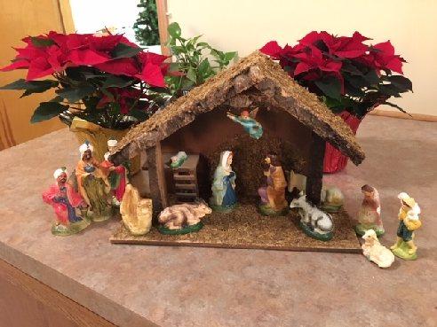 A variety of Nativity Sets are on display on the back counter of the sanctuary.