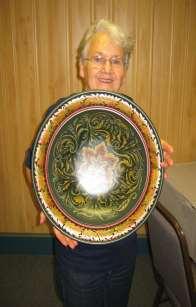 She is the only person who has earned a Vesterheim Gold Medal in both rosemaling AND wood carving!
