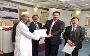 Farooq Arbi  presenting Fellowship Certificate Delete to Engr.