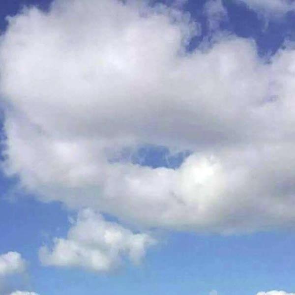 In the clouds a shape appears