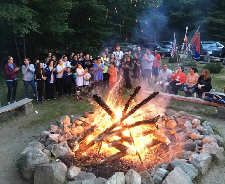 The 50 scouts participated in various activities including building the flag pole structure, crafting a bonfire, and competing in athletic events.