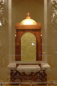 Tabernacle and Vigil Light - The tabernacle is the ornate place where the Eucharist is reserved.
