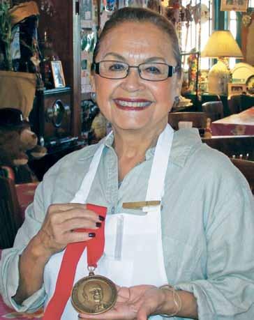 Irma Galvan proudly holds her James Beard Award. Irma s was the only restaurant from Texas to win in 2008. tacos to school.