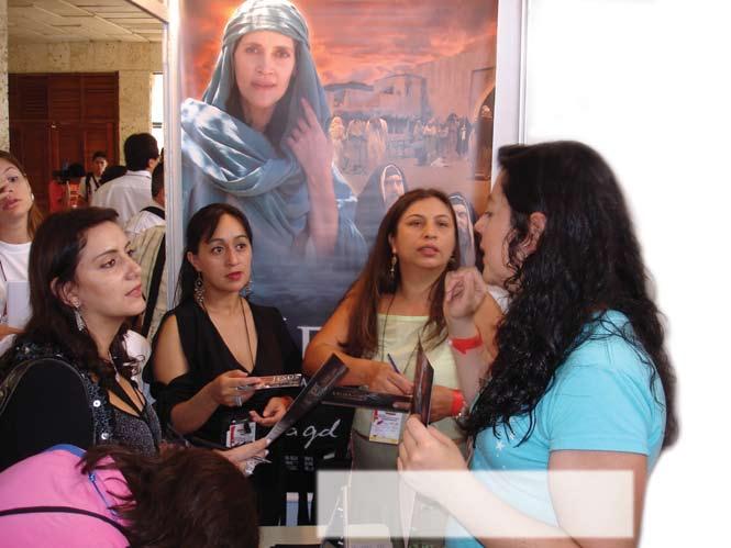 Women in ministry from many countries in Latin America receiving DVDs and additional information on the film at the Latin American premiere of Magdalena: Released From Shame held in Colombia.