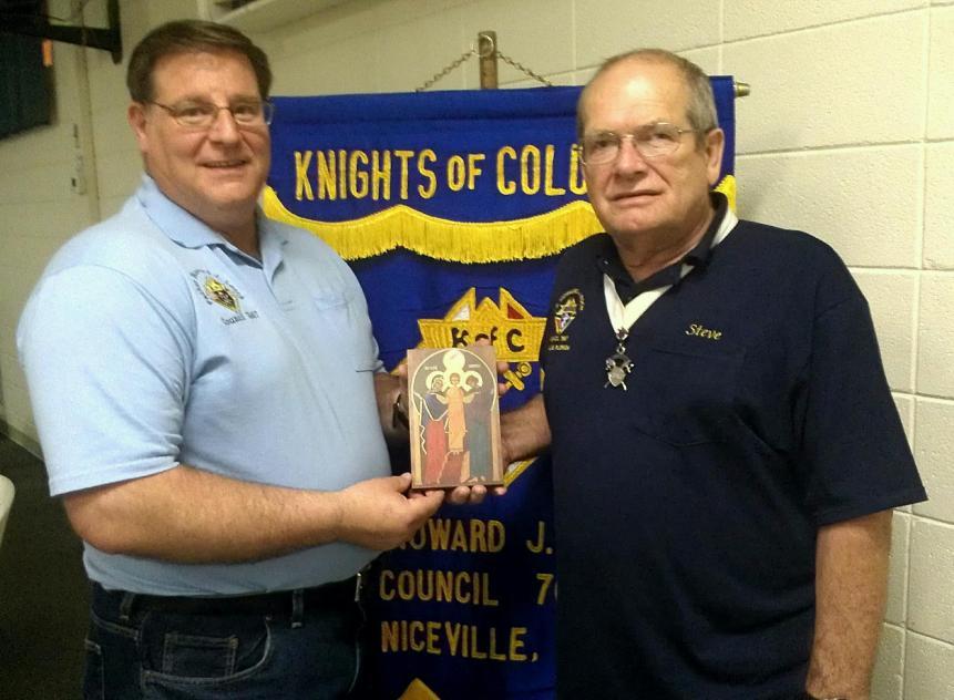 GK Tom Elsesser presenting Brother Steve Sharpe with a congratulatory letter and plaque received from Supreme Knight Karl Anderson.