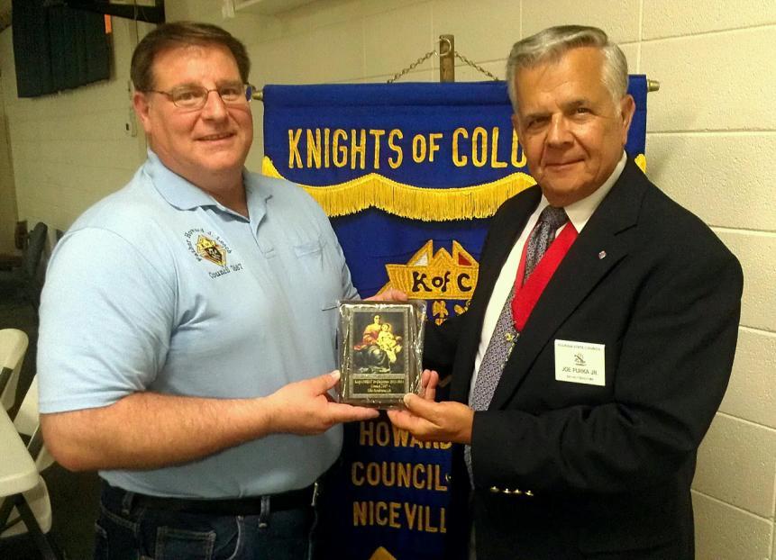 Elssesser with a Keep Christ in Christmas Plaque, received from the State Convention.