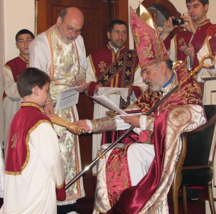 His Eminence Archbishop Oshagan Choloyan, bestowing the rank of "Tûbir" upon Nerses Donoyan.