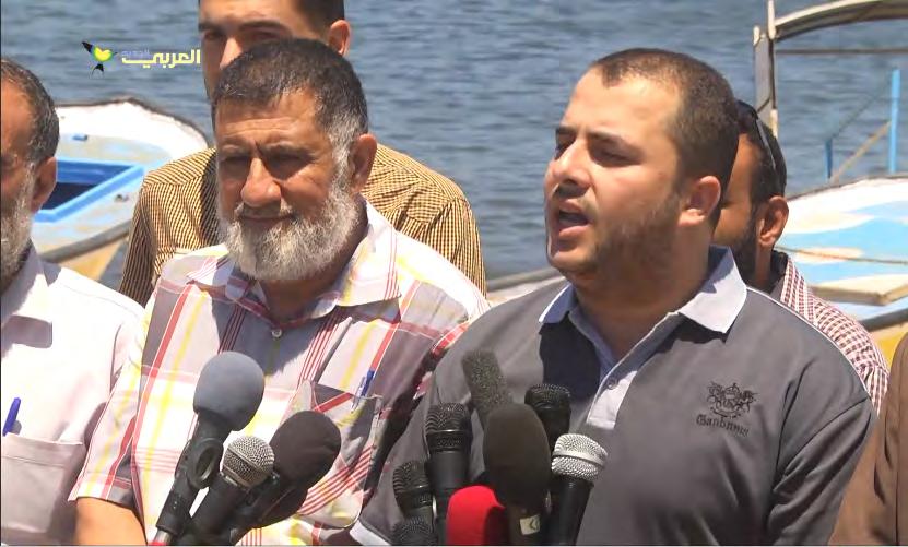 19 Adham Abu Salmiya, spokesman for the "authority for lifting the siege on the Gaza Strip," holds a press conference in the port of Gaza after the al-awda was halted by the Israeli navy (al-arabi