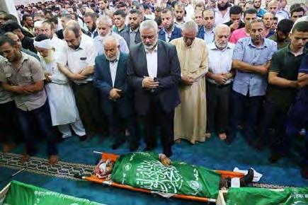 8 Isma'il Haniyeh, Khalil al-haya and other senior Hamas figures at the funeral held for the three operatives of Hamas' military wing (Twitter account of Hamas' military wing, July 26, 2018).