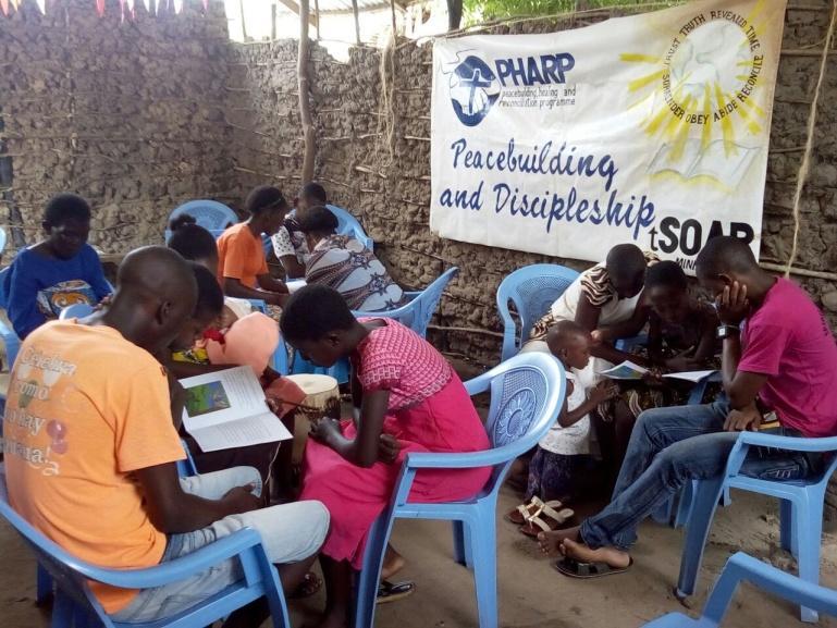 Youths in discussion on what causes conflict DEVELOPMENT WORK IN JILORE- MALINDI THROUGH THE MONTH OF APRIL Adult literacy: A new group of women interested in adult literacy was started with 24