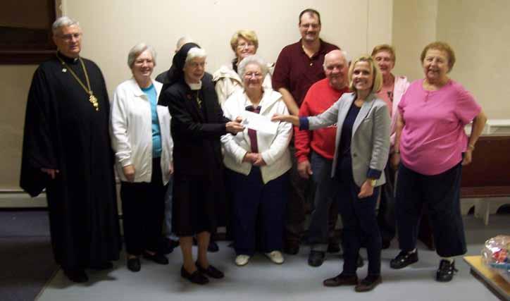 15 The SS. Peter and Paul Church, Minersville Church Council made a presentation to Sister Catherine T. Brennan for the Society of St. Vincent de Paul, in the parish of St.