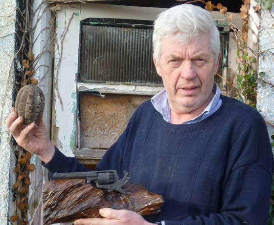 MICHAEL NEVILLE WITH A DISUSED REVOLVER &