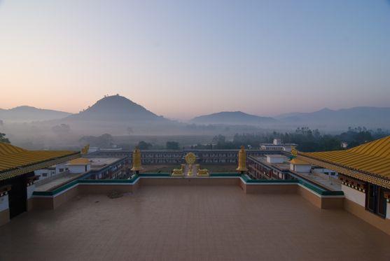 OUTSIDE THE MONASTERY View from the monastery roof at dawn (upper left) Stupas (upper right)