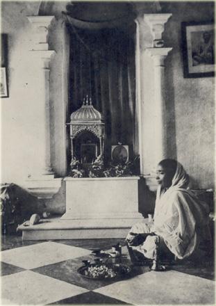B.Dutta took this photo of the Mother in Bengali year1316 and 1909 A.D. while Mother was worshipping at the shrine at her bedroom at Udbodhan i.
