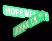 Street sign showing the intersection of Hopewell and Indian Creek Roads. On this corner is where the one room Denny s Seminary Schoolhouse used to be. Down this road was the Timothy Denny farm.