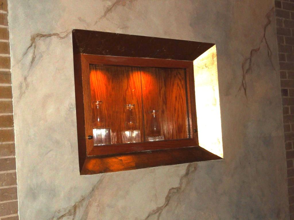 Ambry - the cabinet where three Holy Oils are kept. Oil of Catechumens is used the sacrament of baptism.