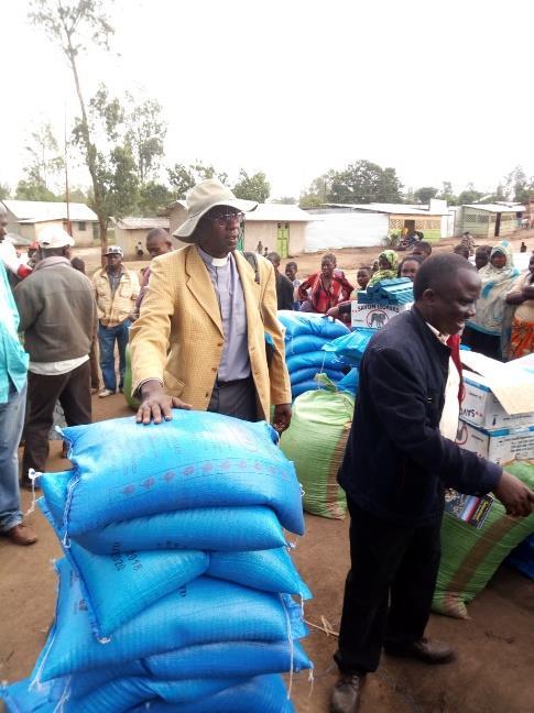 Reverend Japhet Barozi of All Saints Parish during distribution on the 22 nd of August 2018 Vulnerable families in IDPs camp Bunia From Revd Bisoke Balikenga, Provincial Youth Coordinator.