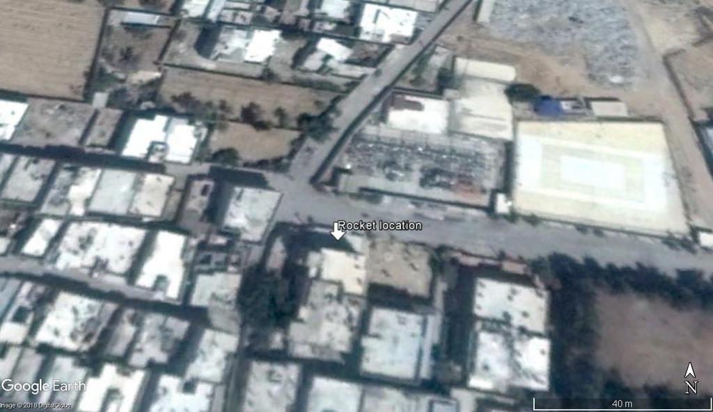 The location of the rocket photographed on the rooftop. Photo credit: Google Earth/Digital Globe Jamal al-hasan noted that the rocket was carrying a white material similar to ice on its surface.