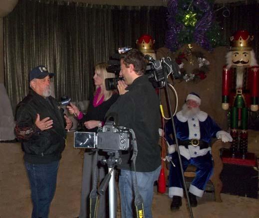 Popular country music radio station KOKE hosts the Blue Santa Breakfast and remote broadcast while accepting donations.