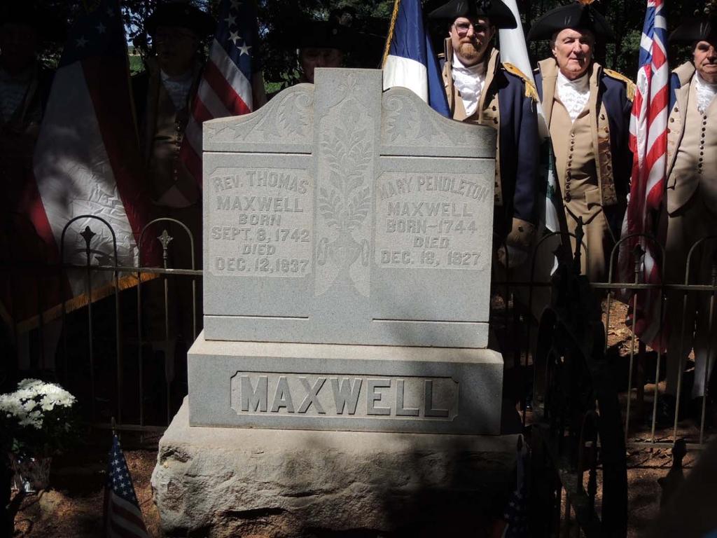 Members of the State Color Guard stand behind the Maxwell