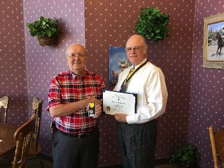 State President presents certificate and streamer to President Wayne Hood at October Chapter