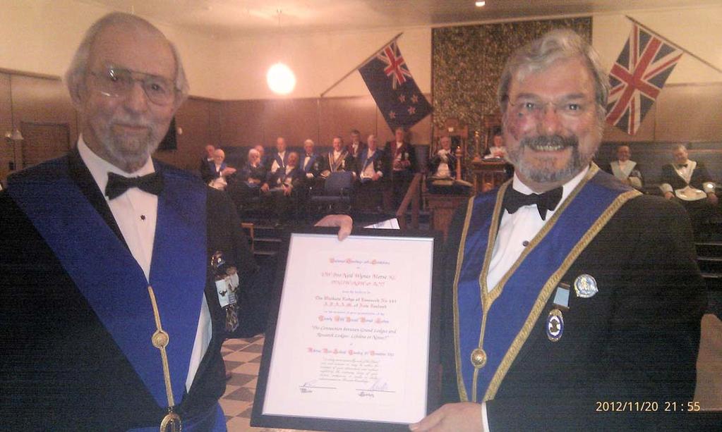Neil Morse (right) receiving a framed certificate commemorating his Verrall Lecture from Peter Verrall, foundation