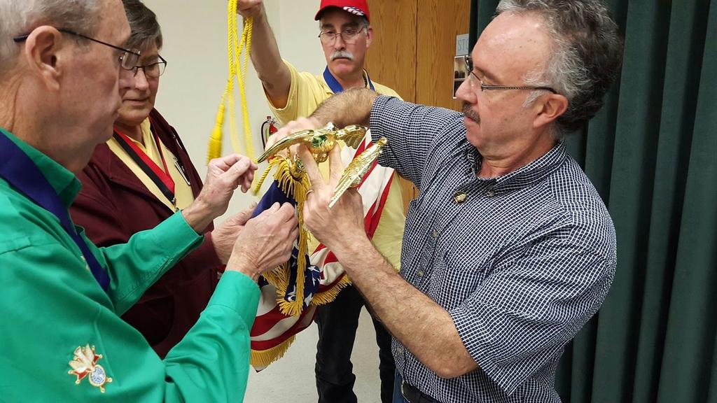 Mother Teresa Assembly Donates Eagle for Flag Pole FN Jorge Gonzalez presents and installs