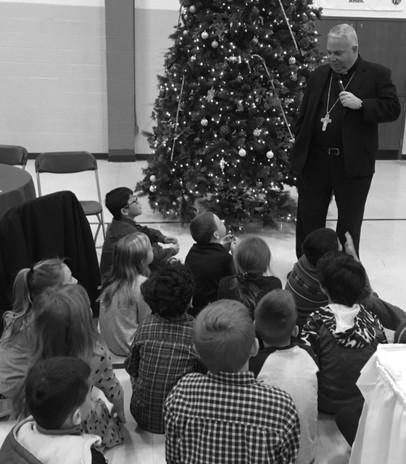 Bishop Perez was a big hit with our 2 nd Graders last week as he gathered them around his feet to talk with them about the Sacrament of Confession.