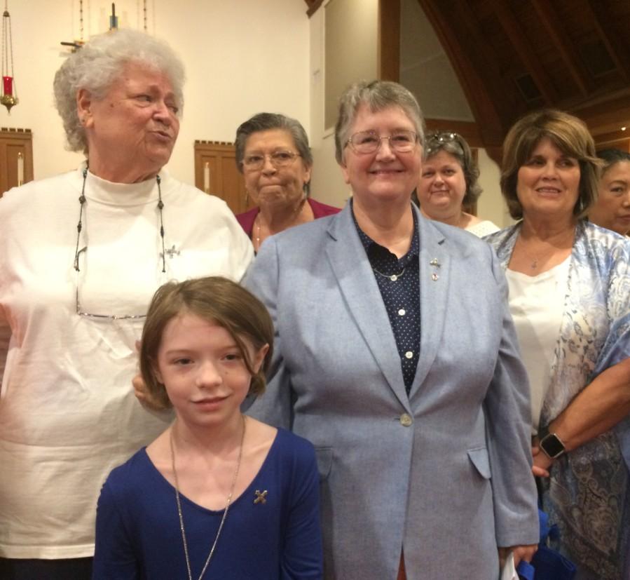 Parish seeks more acolytes Newly installed members of Daughters of the King (L to R) Suanough Zentell, Julie Dojahn and Donna Lewis and Junior Daughters of the King (front) Reese Cline while (behind)