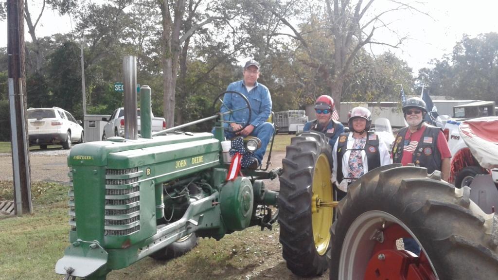 Tyler on his tractor, Tommy, Mary