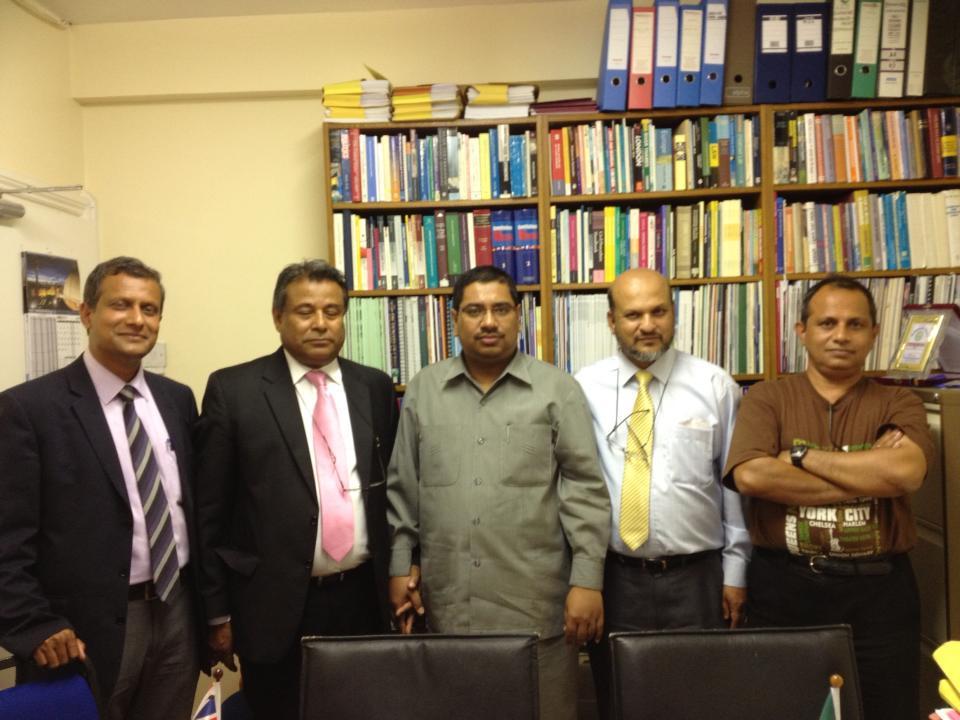 Barrister Nazir Ahmed (middle) at his Chamber in