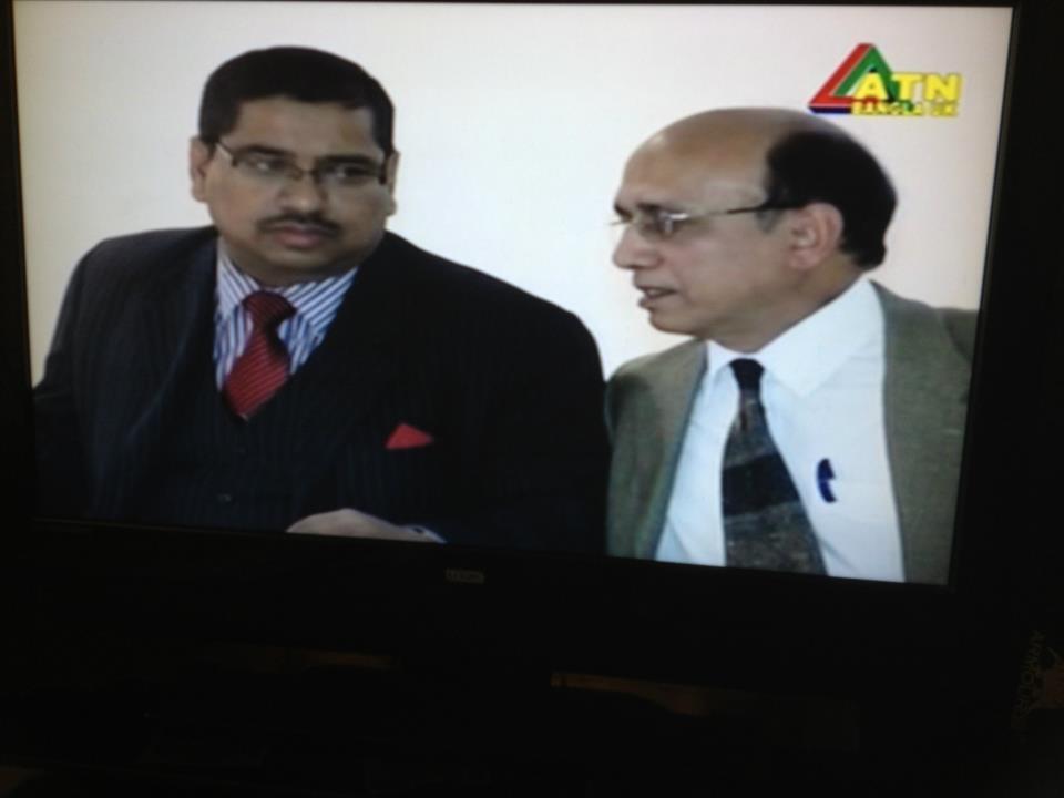 Barrister Nazir Ahmed (right), as a Moderator, is consulting in a seminar