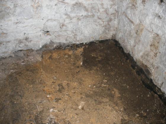 Rochester Cathedral, Medway, Kent: archaeological recording, Deanery Gate House 8 Figure 8: The basement test pits left, pit 3, showing the gravel foundation of Deanery Gate and soil to the west
