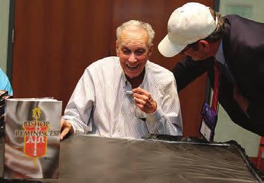Oden signs copies of his latest book, A Bishop Reminisces.