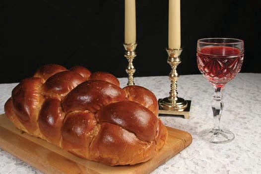 Candles are lit, loaves are blessed and the Kiddush prayer is said over a glass of wine at the start of the Shabbat meal Shabbat continues as a day of rest until sunset the next day.
