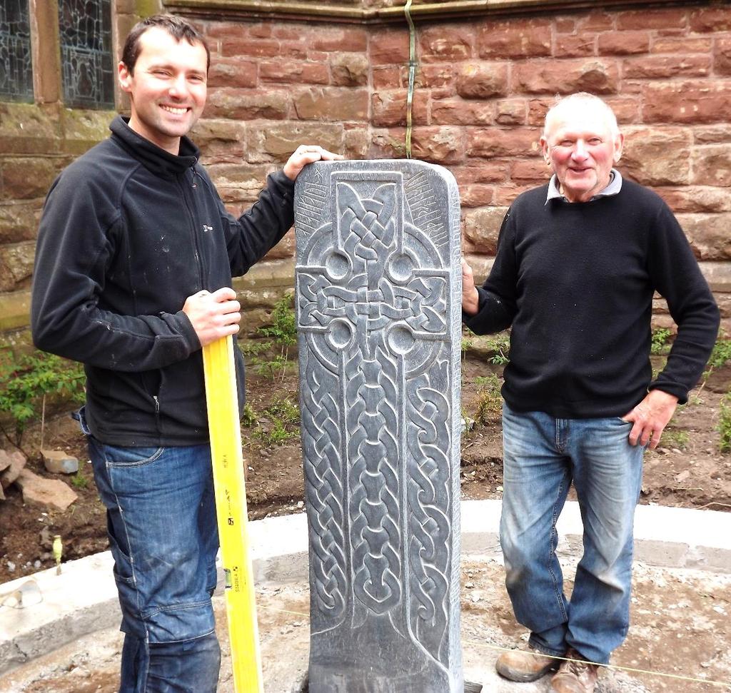 Chris and Kenny Stokes installing one of the Manx Celtic