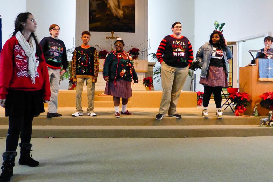 the Ugly Sweater contest modeled their creative holiday attire.
