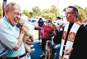 St. Maria Goretti pastor Father Jim Gigliotti, TOR, blesses parishioners and their pets on Sept. 28.