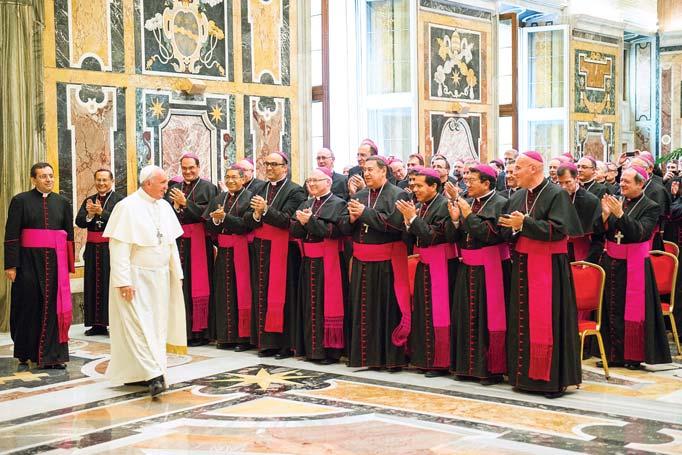 Pope Francis and Bishop Olson beam as they greet one another Bishop Michael Olson traveled to Rome in September to meet with the