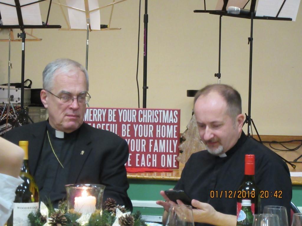 They served themselves appetizers prepared by parishioners as Christmas music played in the background.